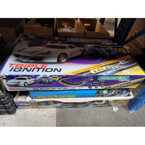 Three Scalextric sets, Rally Pro, Formula 1 and Triple Ignition.