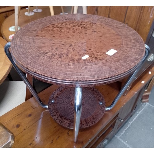 976 - An Art Deco chrome and bakelite circular coffee table.