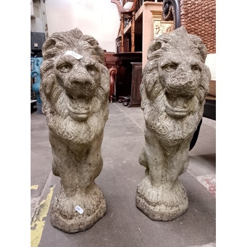 260 - Two garden ornaments in the form of lions.