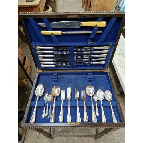 271 - Three canteens of cutlery, one with legs