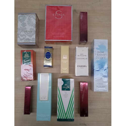 79 - A box containing sealed perfume bottles, Escada, Carven, Tweed, Rochas. A Radley handbag and several... 