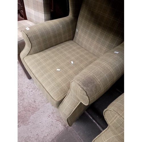 1091 - A tweed Chesterfield style sofa, two Next tweed wingback armchairs and a similar dining chair.