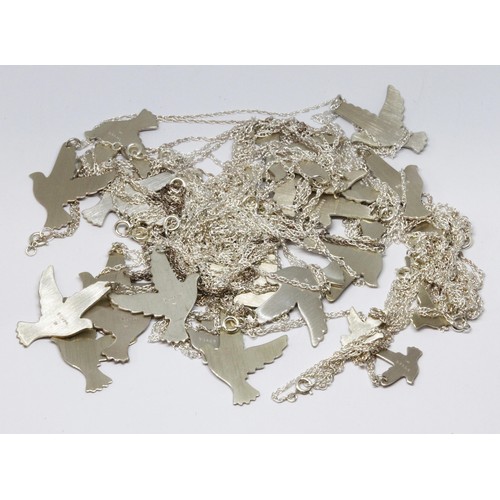 187 - A quantity of bird cut out bird charms and pendants, marked 'silver', some with chains marked 'Sterl... 