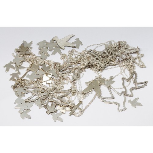 186 - A quantity of bird cut out bird charms and pendants, some marked 'silver', some with chains marked '... 