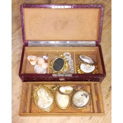 209 - A leather bound jewellery box comprising mainly cameos.