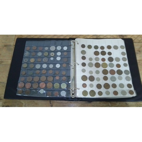 298 - A folder of GB and world coins.