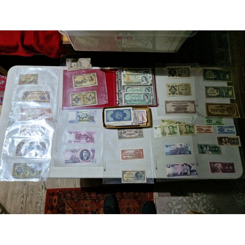 275 - A large collection of assorted world banknotes