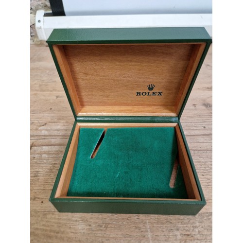 62 - A vintage green gilt green leather Rolex watch box and papers.