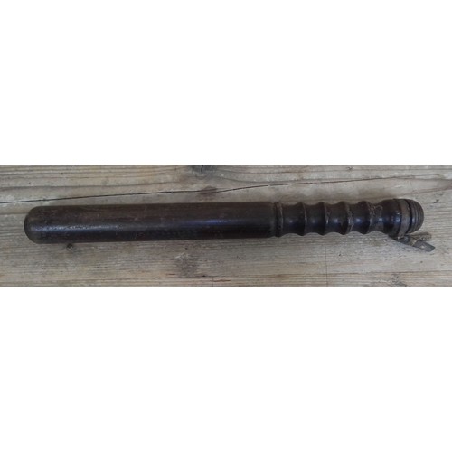 208 - An ebonised mahogany truncheon, length 40cm.