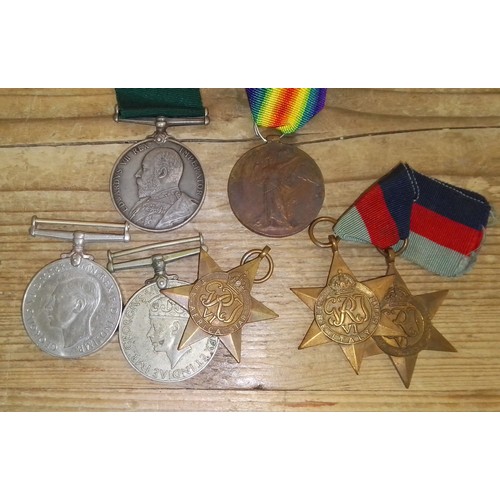 201 - Assorted WWI & WWII medals comprising a Long Service awarded to 1799 SJT. C.B. Capstick. 2/V.B. Bord... 