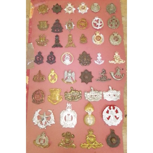 220 - Approx. 43 cap badges.