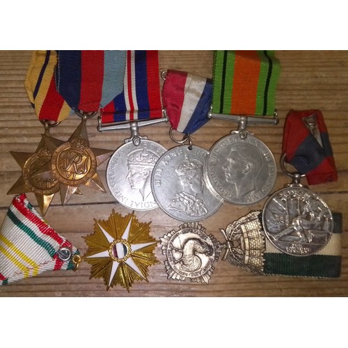 229 - Assorted medals and badges.