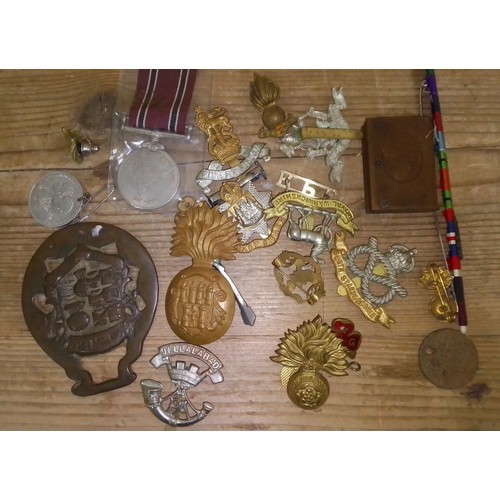 234 - A box of assorted medals and badges.