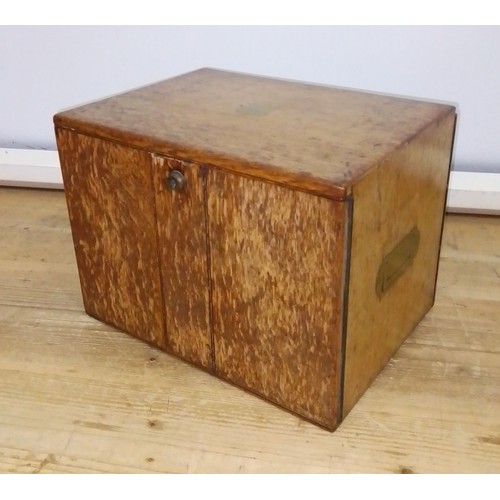 447 - A 19th century oak cabinet with two drawers and campaign style handles.