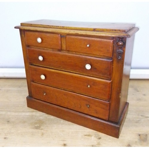445 - A Victorian mahogany 'apprentice' chest of drawers, height 35.5cm.