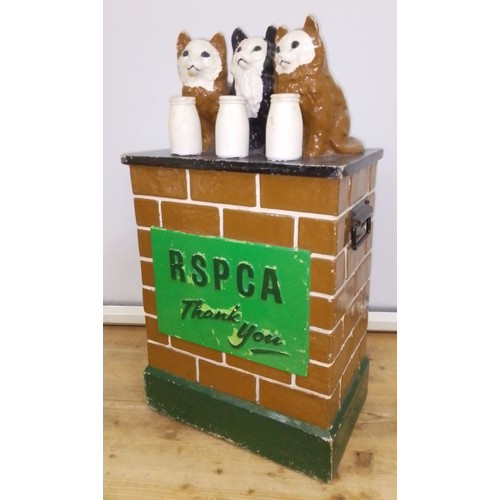 434 - An RSPCA collection box modelled as three cats, each for a milk bottle and sat on a wall, height 74c... 