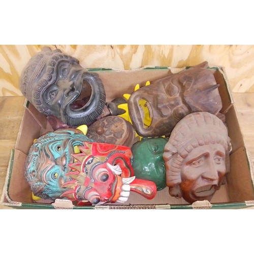 456 - A box of assorted pottery, wooden and metal masks.
