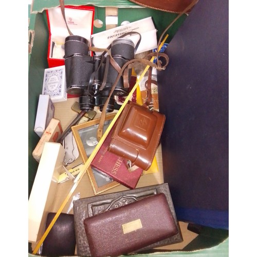 483 - A box of assorted collectables including a pair of binoculars, lighters, pipes, pens, a camera etc. ... 