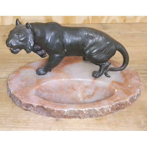 487 - A cold painted spelter tiger on marble base, length 28cm.