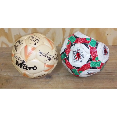 488 - Two signed footballs.