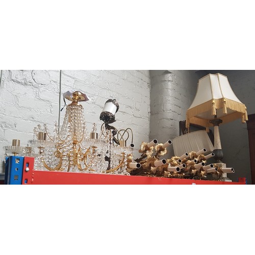 97 - A collection of gilt metal wall lights, a glass drop chandelier, an onyx column table lamp with shad... 