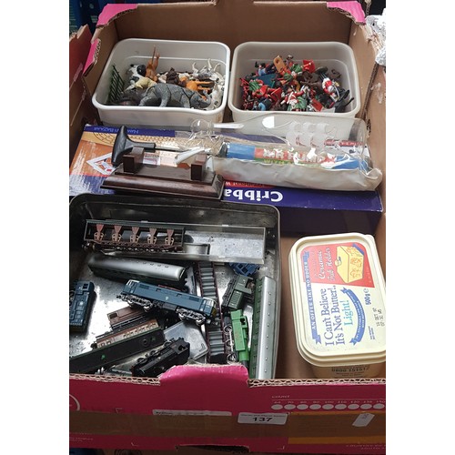 137 - A box of toys including plastic figures, animals, model railway engines, cribbage set, and a box of ... 