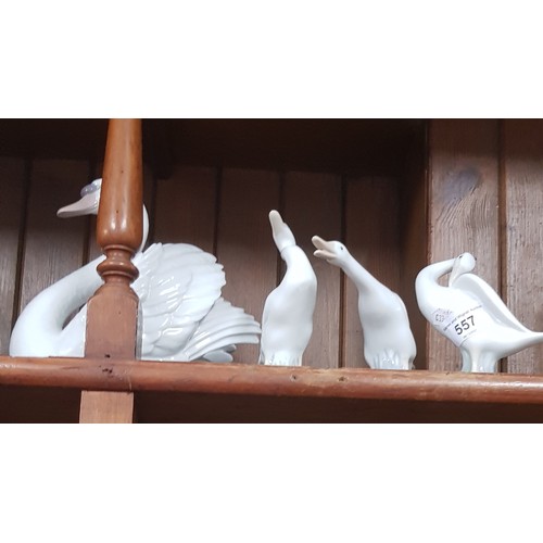 557 - Lladro Swan with Wings Spread (no. 5231) approx 18cm high together with 3 Lladro geese