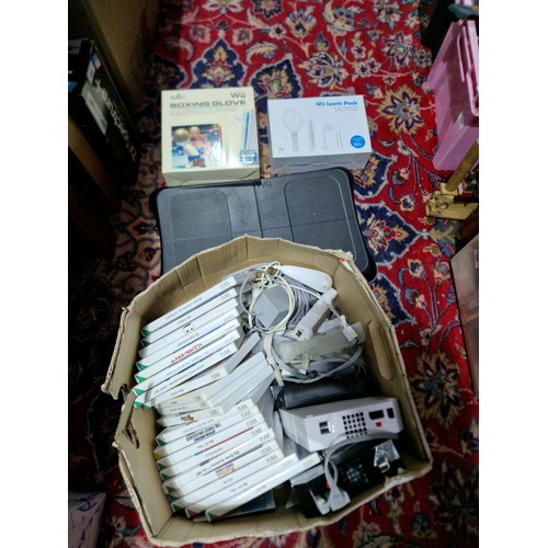 Two Nintendo Wii consoles together with various games, Wii fit board