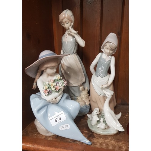 570 - 2 Lladro figurines including ‘Fragrant Bouquet’ (no.5862) together with another Spanish porcelain fi... 