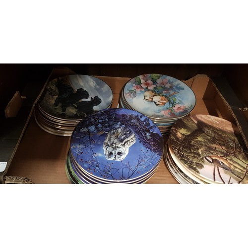 576 - Decorative plates by Wedgwood, Royal Doulton etc. with themes of birds & dogs - approx 33 plates