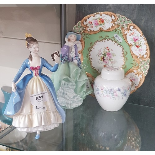 651 - Two Royal Doulton figures, a ginger jar and a plate.