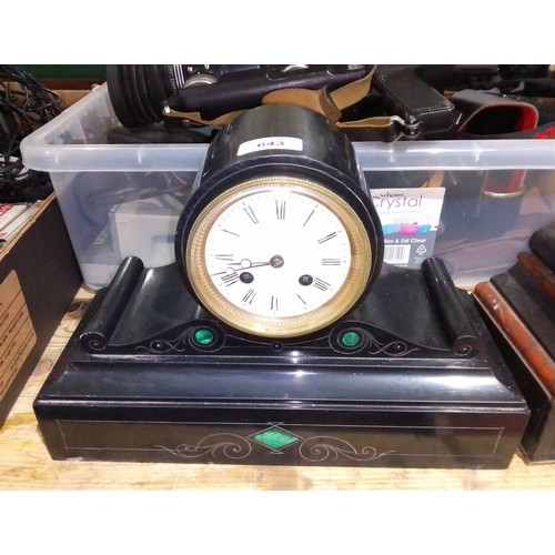 643 - A black slate mantle clock with malachite inlay.