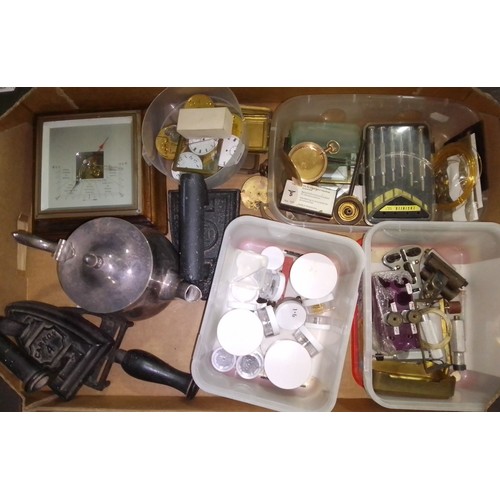 646 - A box containing assorted watch parts, plated teapot, two flat irons & a barometer.