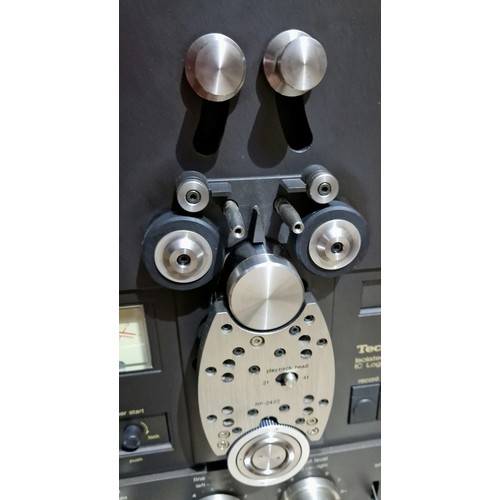 296 - A Technics RS-1506 reel to reel 4 track tape deck.