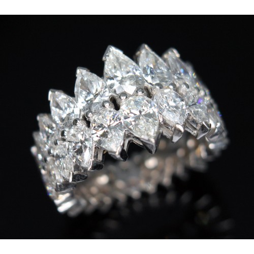 49 - A diamond eternity ring, formed from a double row of diamonds comprising eighteen pear cut diamonds ... 