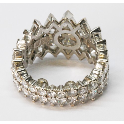 49 - A diamond eternity ring, formed from a double row of diamonds comprising eighteen pear cut diamonds ... 