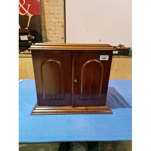 439 - An early 20th century mahogany smoker's cabinet/decanter box, labelled Waring & Gillow, assorted con... 