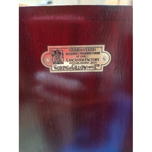 439 - An early 20th century mahogany smoker's cabinet/decanter box, labelled Waring & Gillow, assorted con... 