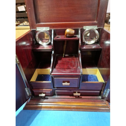 439 - An early 20th century mahogany smoker's cabinet/decanter box, labelled Waring & Gillow, assorted con... 