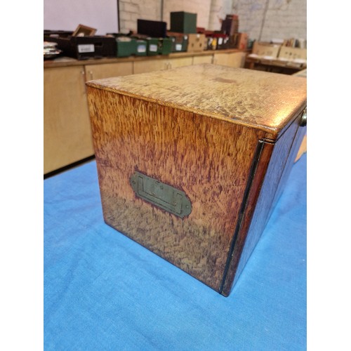 447 - A 19th century oak cabinet with two drawers and campaign style handles.