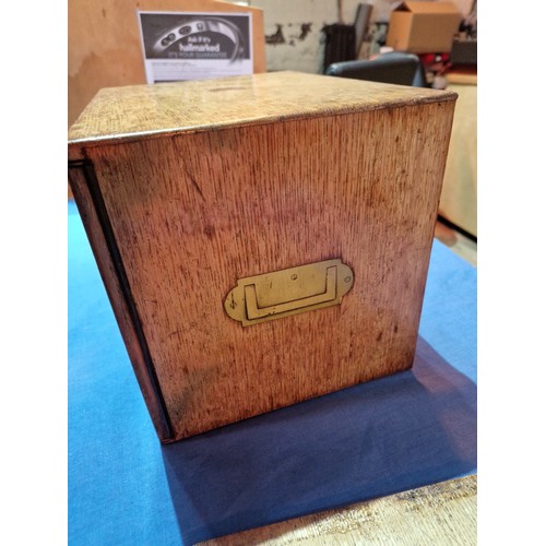 447 - A 19th century oak cabinet with two drawers and campaign style handles.
