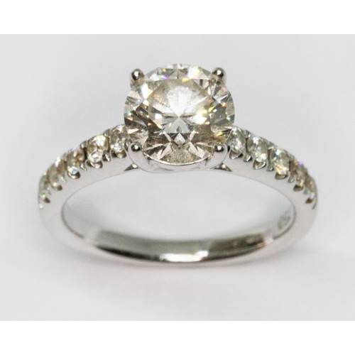 171 - A diamond solitaire ring, the principal four claw set round brilliant cut stone weighing approx. 1.5... 