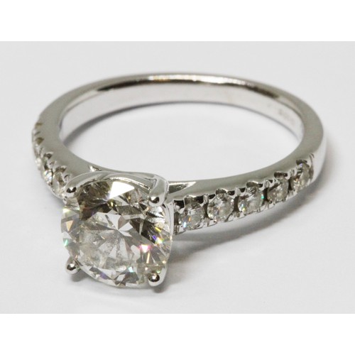 171 - A diamond solitaire ring, the principal four claw set round brilliant cut stone weighing approx. 1.5... 