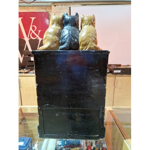 434 - An RSPCA collection box modelled as three cats, each for a milk bottle and sat on a wall, height 74c... 
