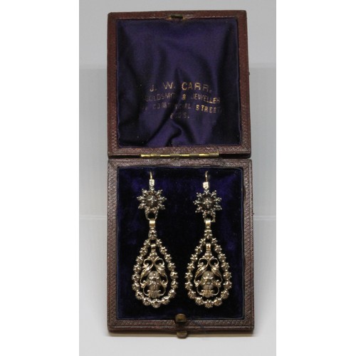 5 - A pair of Georgian diamond earrings, each formed as a central scroll drop set with single diamond su... 