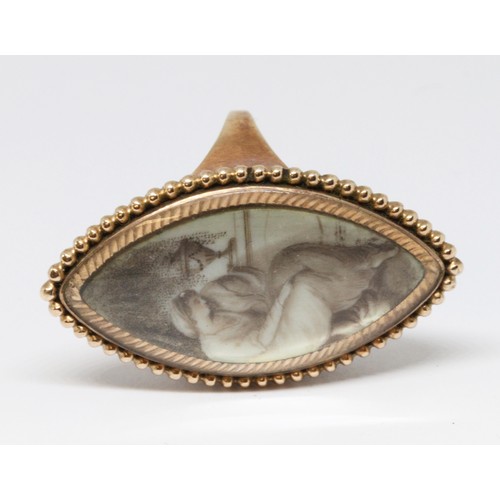 3 - A Georgian mourning ring, the navette shaped ivory panel painted en grisaille depicting a lady seate... 