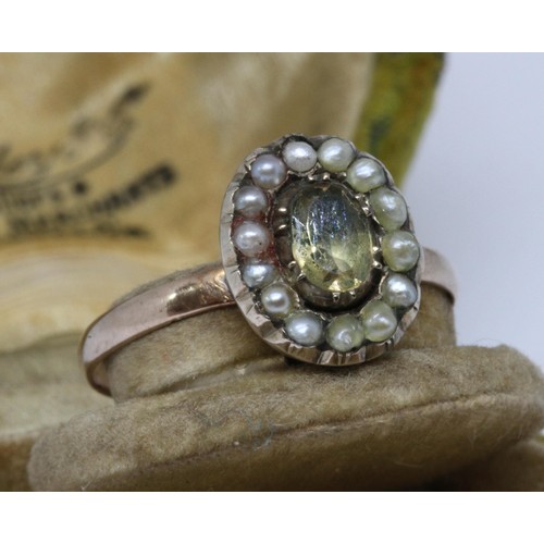 9 - An antique split pearl and foiled back paste ring, the oval cluster measuring approx. 6mm x 10mm, ba... 