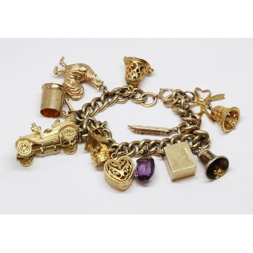 20 - A 9ct gold charm bracelet, seven hallmarked 9ct gold charms, two unmarked and one indistinctly marke... 