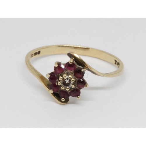 35 - A hallmarked 9ct gold diamond and ruby ring, gross weight 1.3g, size M.