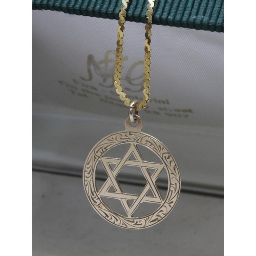 39 - A hallmarked 9ct gold star of David pendant on 58cm S link chain marked with 9ct gold import marks, ... 